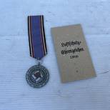 Luftschutz Médaille 2éme Classe 1938  et sachet 
