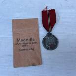 WH Médaille de l'est 1941/42 et sachet 